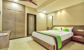 Deluxe Room | Desk, iron/ironing board - Treebo Sriz Cozy Seethamadhara (Visakhapatnam)