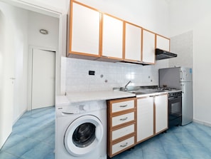 Fridge, oven, stovetop, dining tables