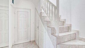 A clean, white interior with a marble staircase and a door. - Villa in Orebić near Sea Beach (Orebić)