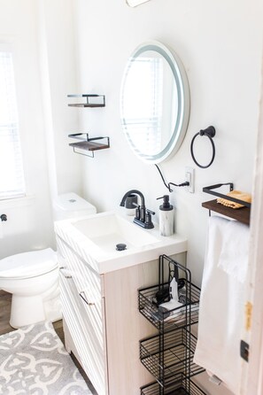 Bathtub, hair dryer, towels, soap