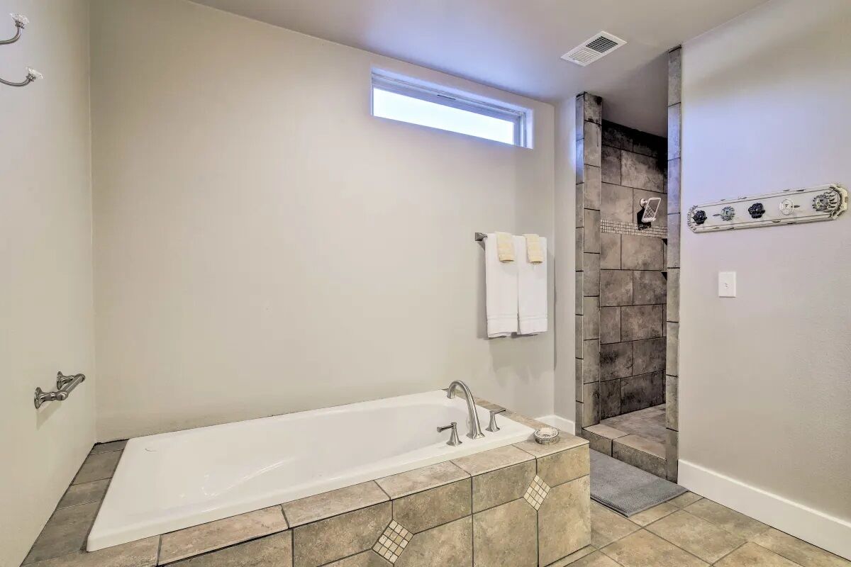 Bathtub, hair dryer, towels