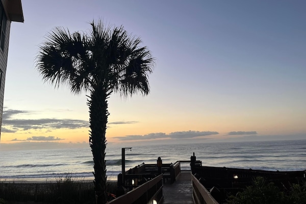Walkway from building to the beach
