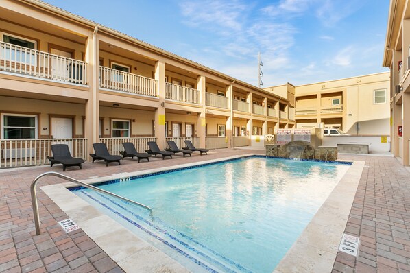 Outdoor pool, open 10:00 AM to 10:00 PM, pool umbrellas, pool loungers