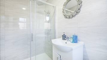 Combined shower/tub, hair dryer, towels, soap