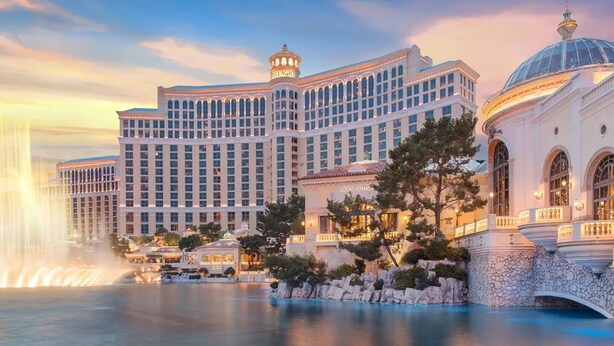 A large hotel with multiple stories, a prominent bell tower, and a fountain in the foreground. - Perfect Las Vegas Private Retreat w/ Pool & Spa! (Las Vegas)