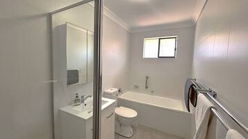 Bathtub, hair dryer, towels