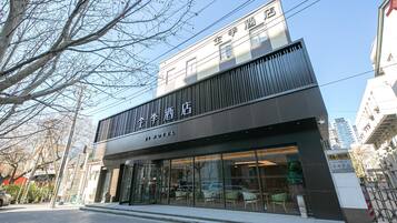 A modern hotel with a prominent sign indicating it is a hotel.