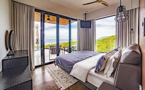 Relax in comfort with a large bed, flat-screen TV, and patio area.