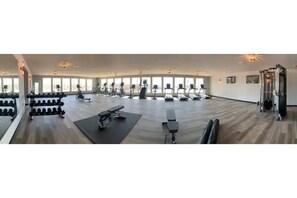 Stay fit on your vacation with a fully equipped gym featuring treadmills, stationary bikes, and free weights.