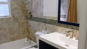 Combined shower/tub, hair dryer, towels, soap