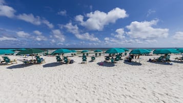 On the beach, sun loungers, beach towels