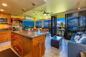 Enjoy meals in the kitchen with a dining area and large window offering ocean views.