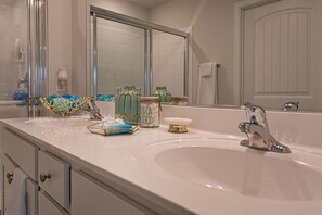 Combined shower/tub, hair dryer, towels, soap