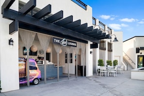 Enjoy casual dining and socializing at The Splash Lounge, offering outdoor seating and food services.