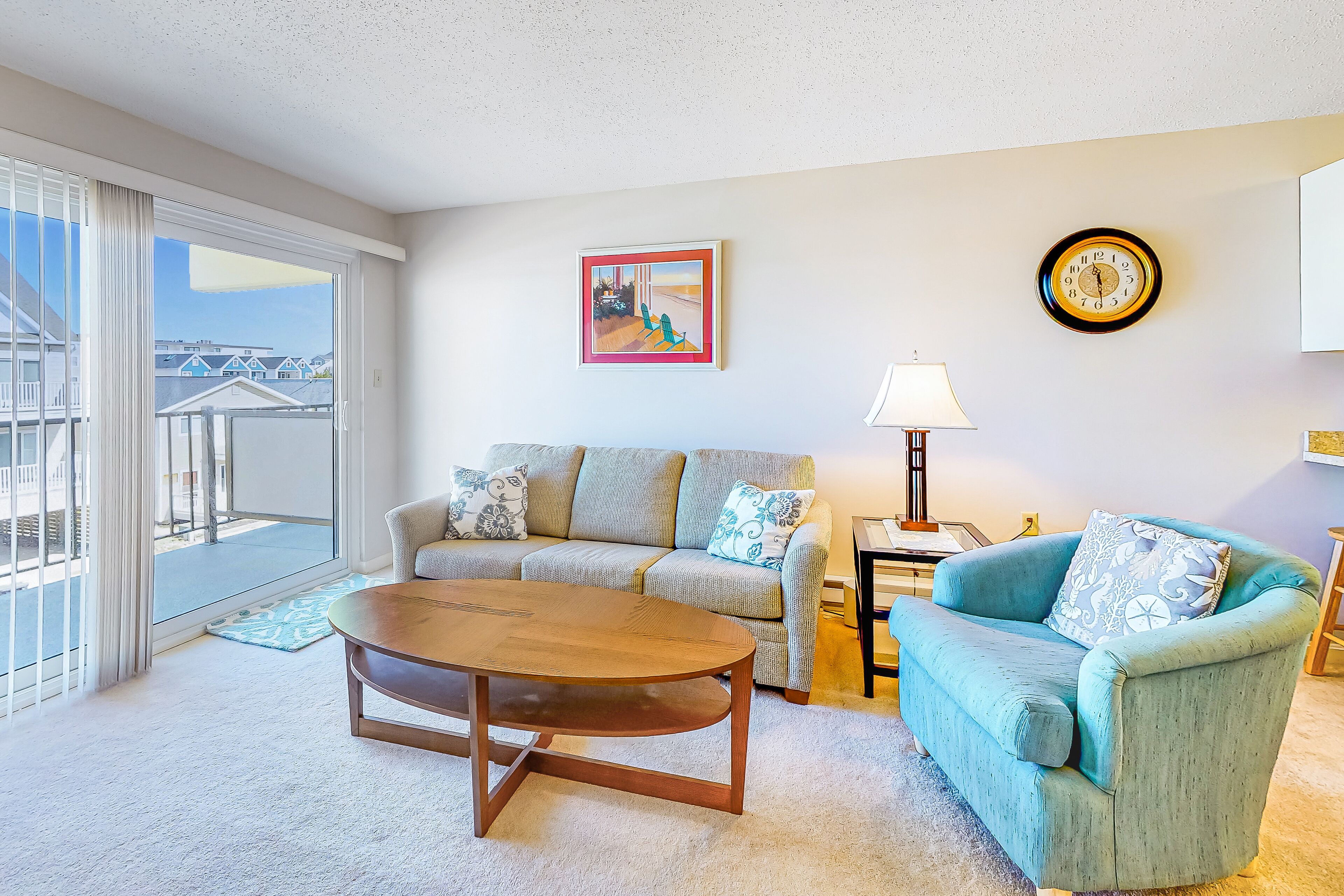 Beachside condo with balcony, ocean views, outdoor shower, and walkable locale