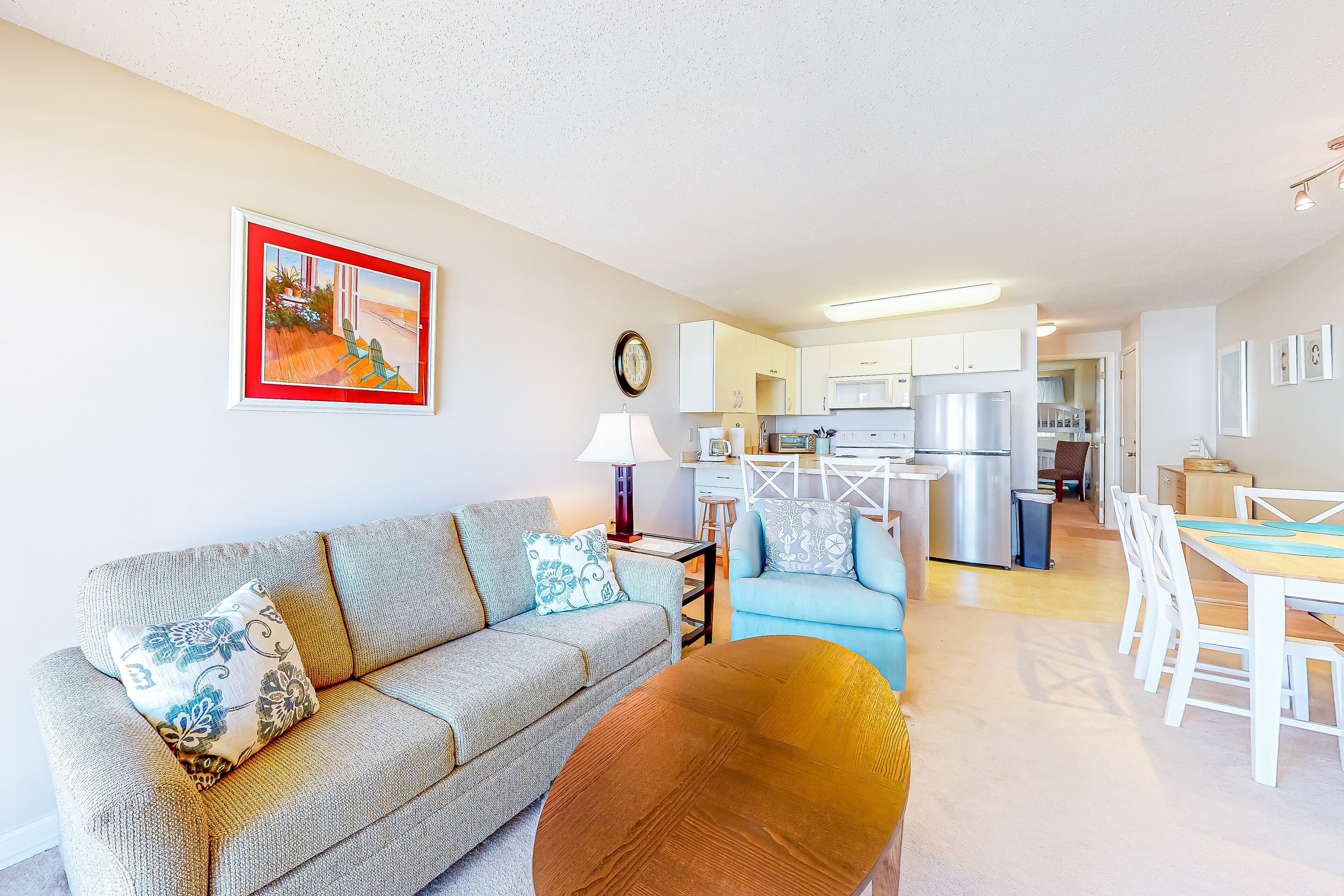 Beachside condo with balcony, ocean views, outdoor shower, and walkable locale