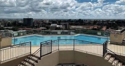 Stunning condo with a rooftop pool & terrace + panoramic city views