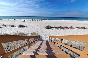 Guests can enjoy access to the ocean and sandy beach via the wooden steps.