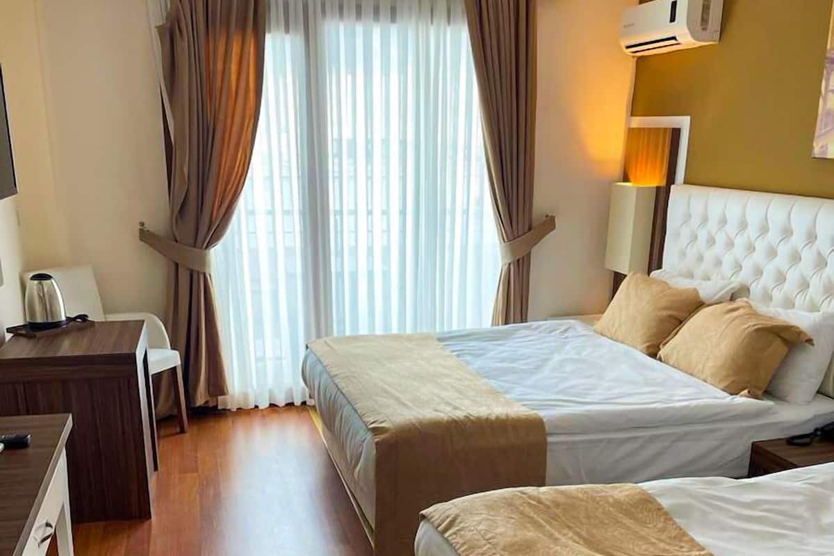 2 habitaciones, minibar y caja de seguridad en la habitación
