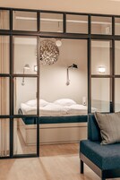 Atelier Apartment | Premium bedding, laptop workspace, blackout drapes, free WiFi