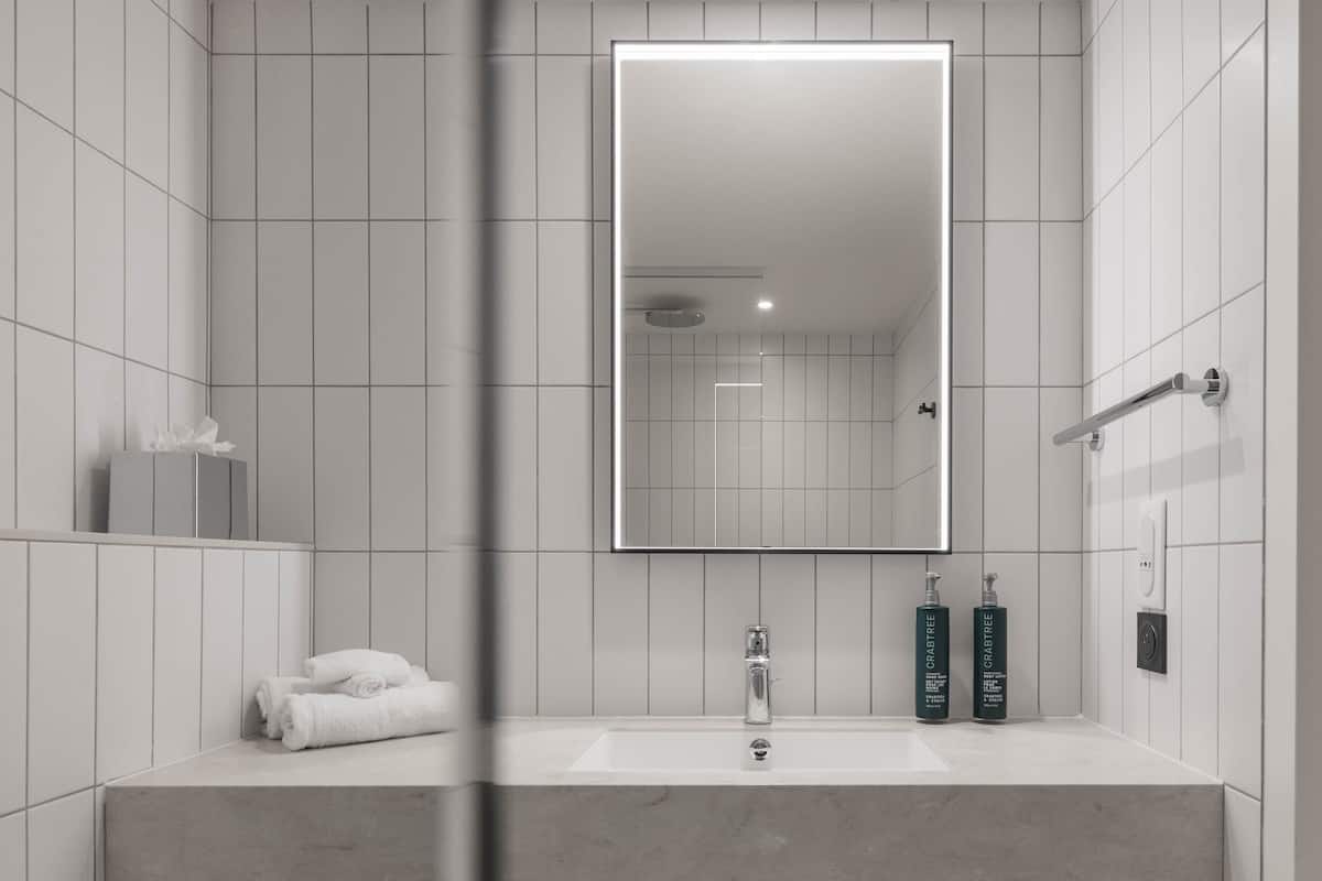 classic room, 2 single beds | bathroom | combined shower/bathtub, hair dryer, slippers, towels