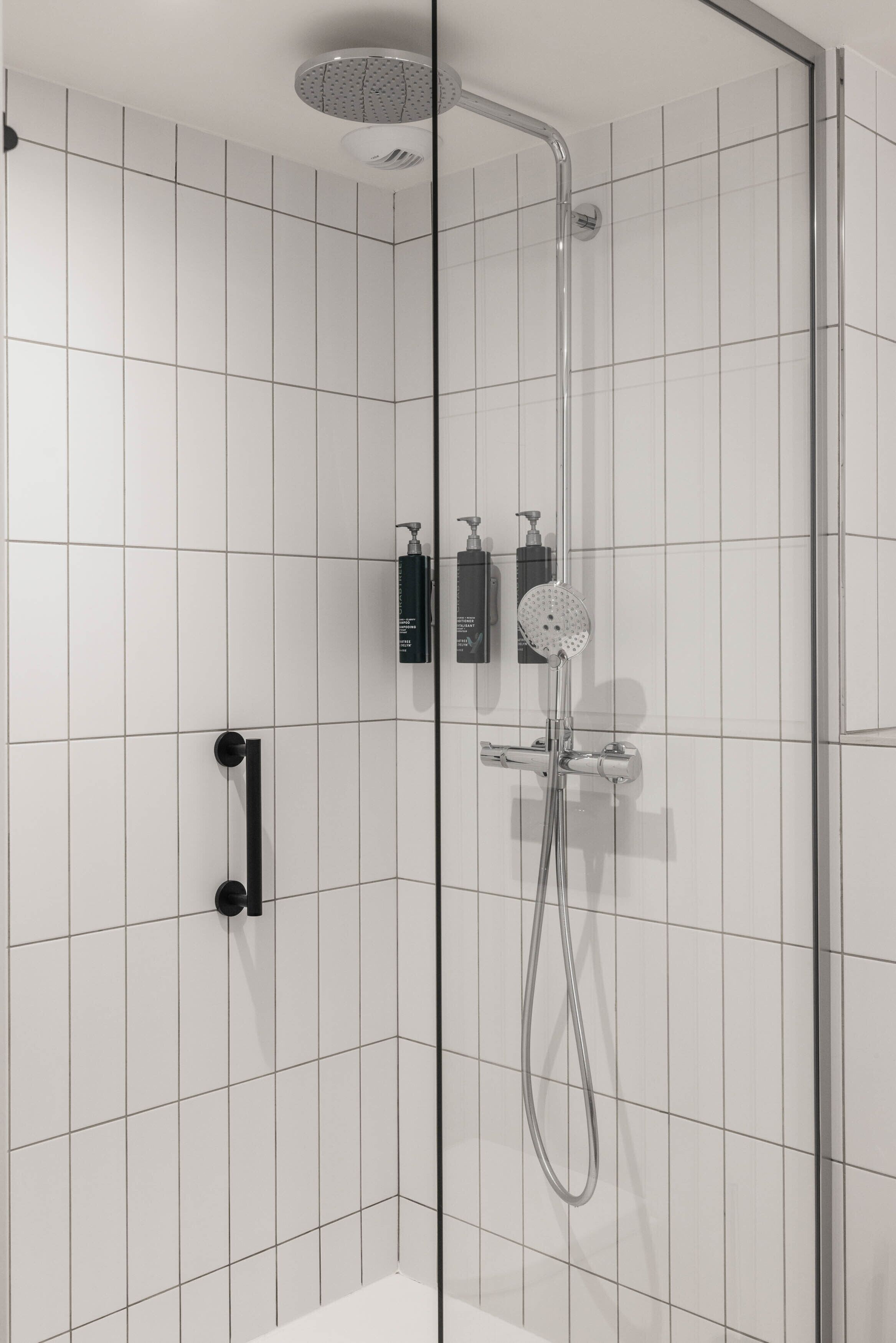 deluxe room, 1 king bed with sofa bed | bathroom | combined shower/bathtub, hair dryer, slippers, towels