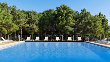 Seasonal outdoor pool, open 10:00 AM to 8:00 PM, pool umbrellas