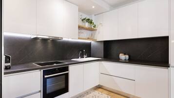 Luxury Apartment, 1 Bedroom | Private kitchen | Full-size fridge, oven, stovetop, dishwasher