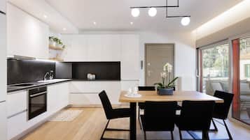 Luxury Apartment, 1 Bedroom | Private kitchen | Full-size fridge, oven, stovetop, dishwasher