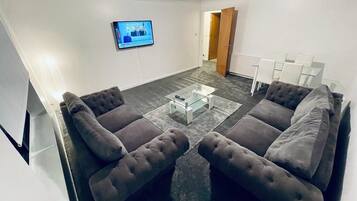 Comfort Apartment | Living area | 55-inch LED TV with digital channels, TV