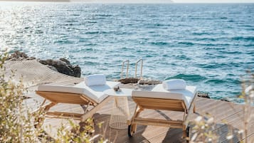 On the beach, free beach shuttle, sun loungers, beach umbrellas
