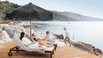 On the beach, free beach shuttle, sun loungers, beach umbrellas
