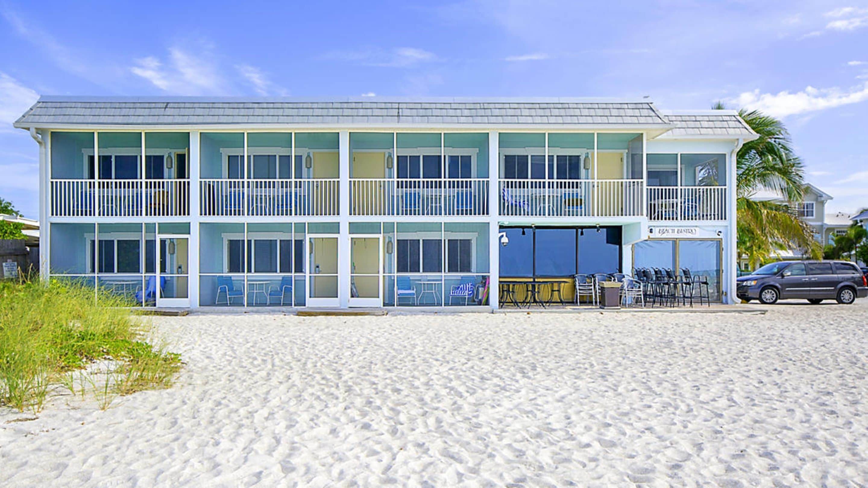 On the beach, white sand, sun-loungers, beach umbrellas