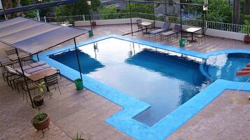 Outdoor pool, open 9:30 AM to 10:00 AM, free pool cabanas