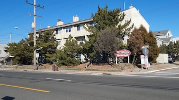 A multi-story building with a prominent sign for Dunes of Otley.