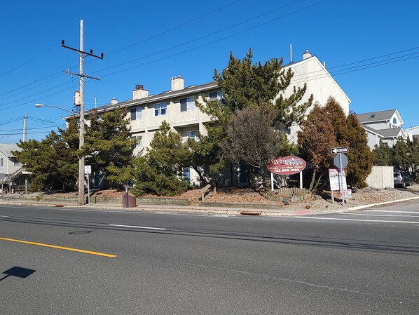 A multi-story building with a prominent sign for Dunes of Otley.