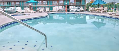 Seasonal outdoor pool, open 9:00 AM to 10:30 PM, pool loungers