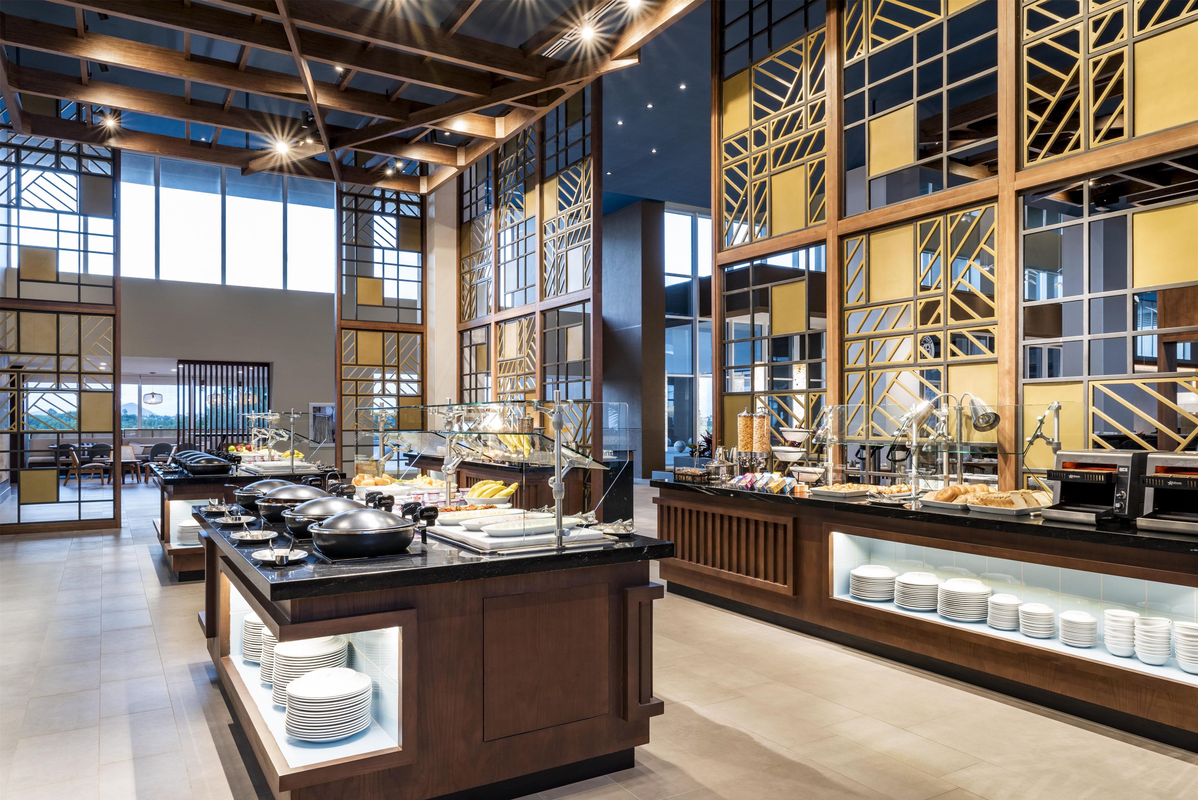 A spacious buffet area with a variety of food options and a seating area with tables and chairs.