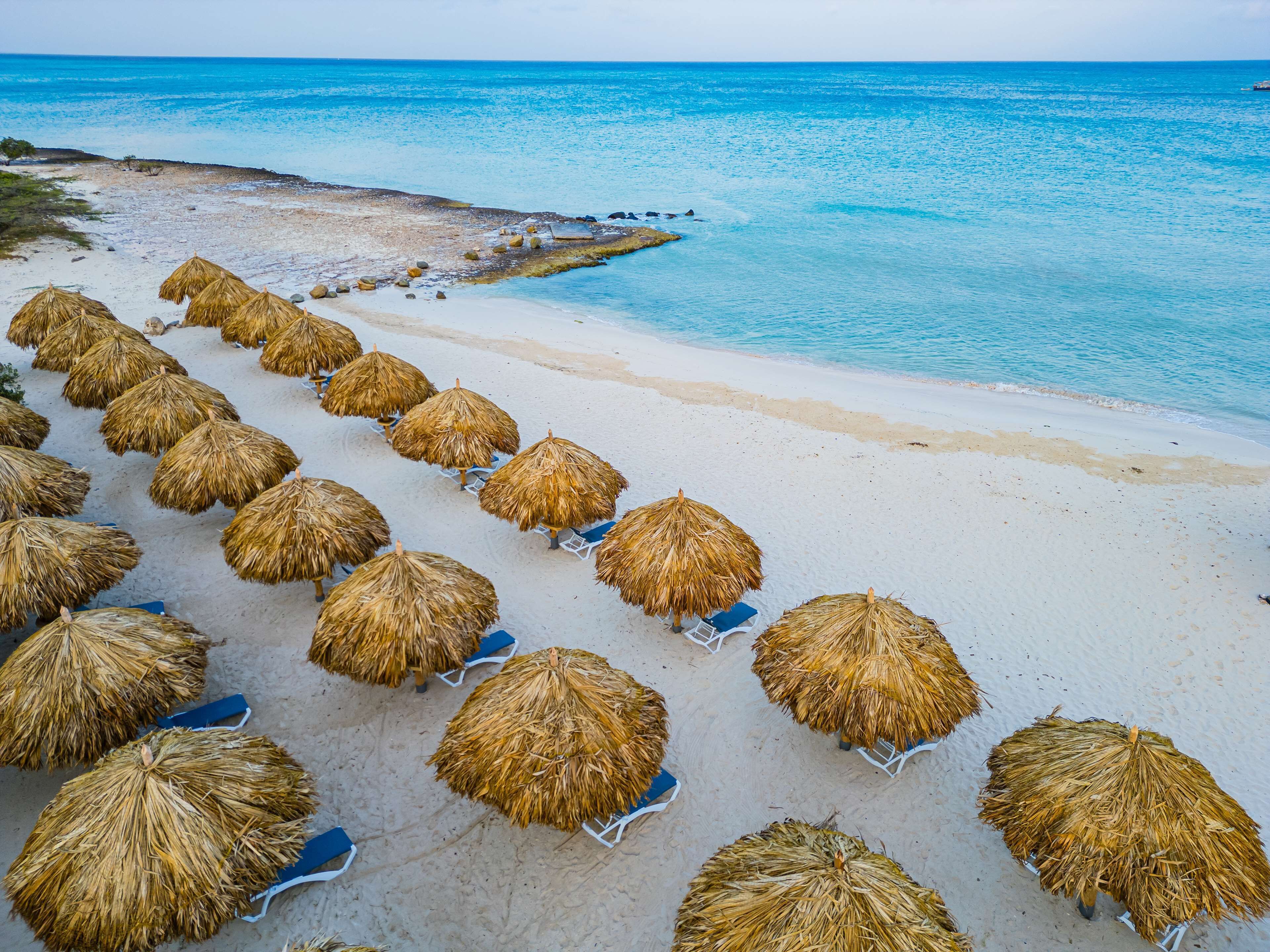 On the beach, white sand, free beach cabanas, sun-loungers