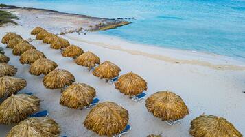 On the beach, white sand, free beach cabanas, sun-loungers