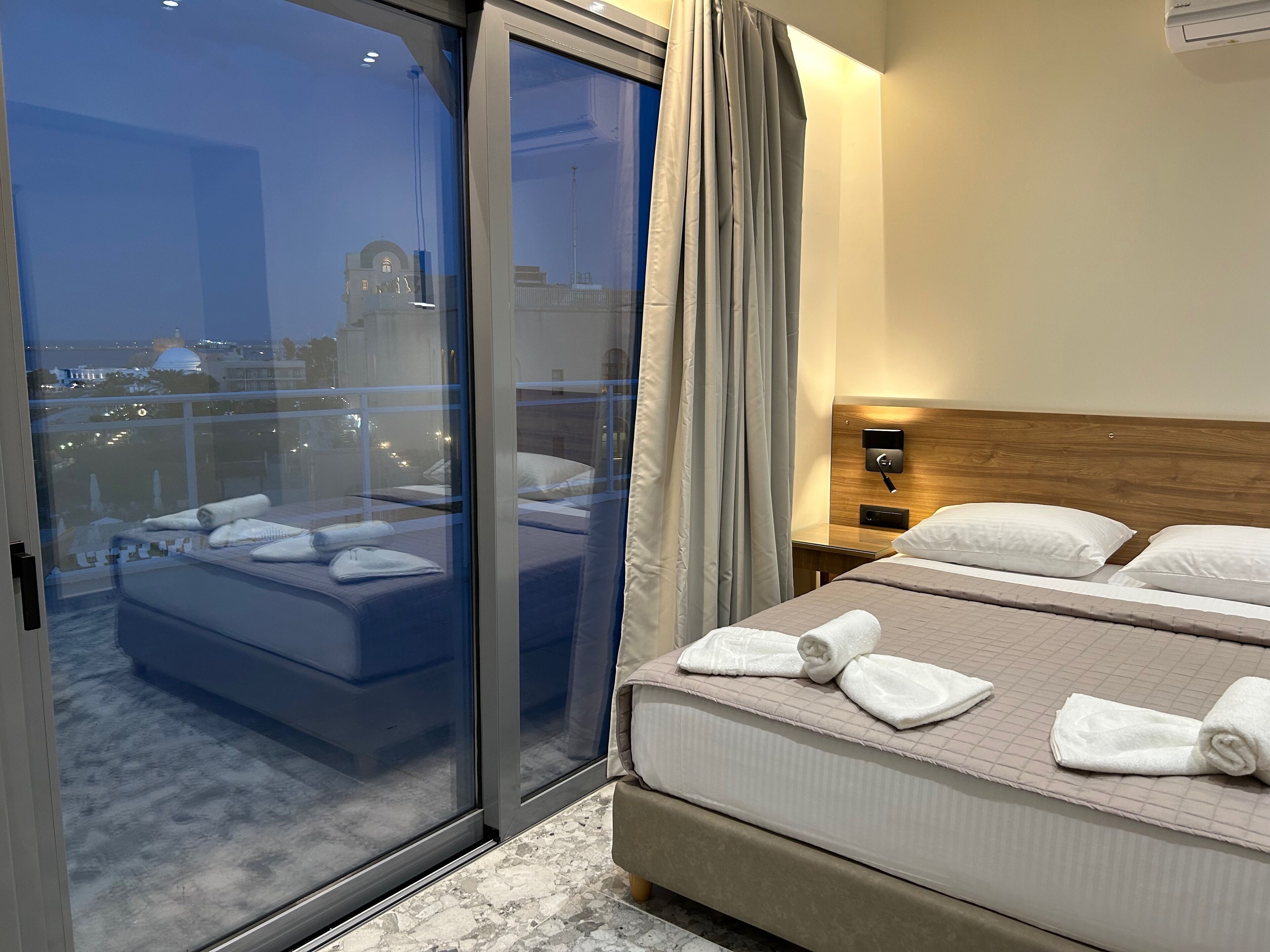 Suite, Balcony, City View | Blackout drapes, free WiFi