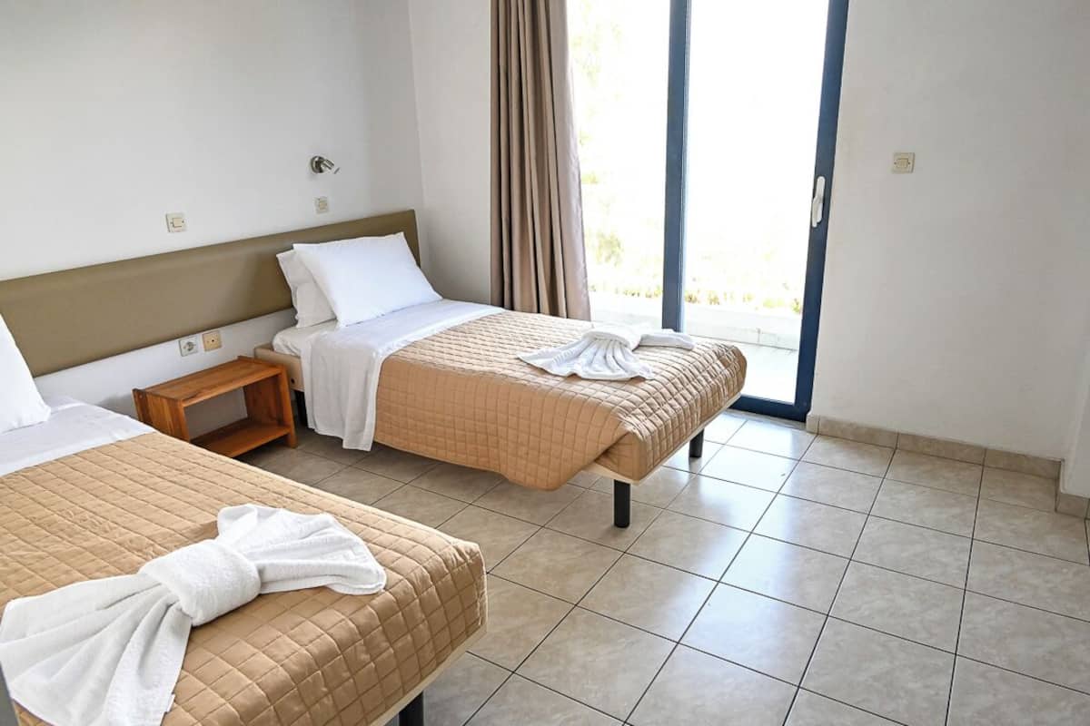 Standard Triple Room, Balcony, City View | Blackout curtains, free WiFi