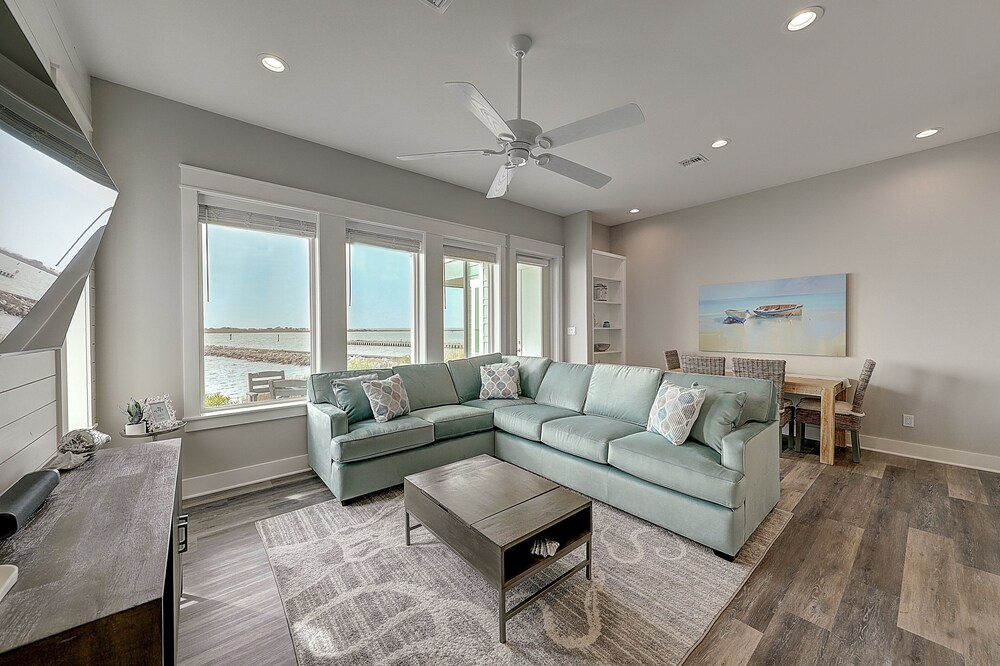 Waterfront haven with Bay views, patio, luxe suites, and shared dock and pool