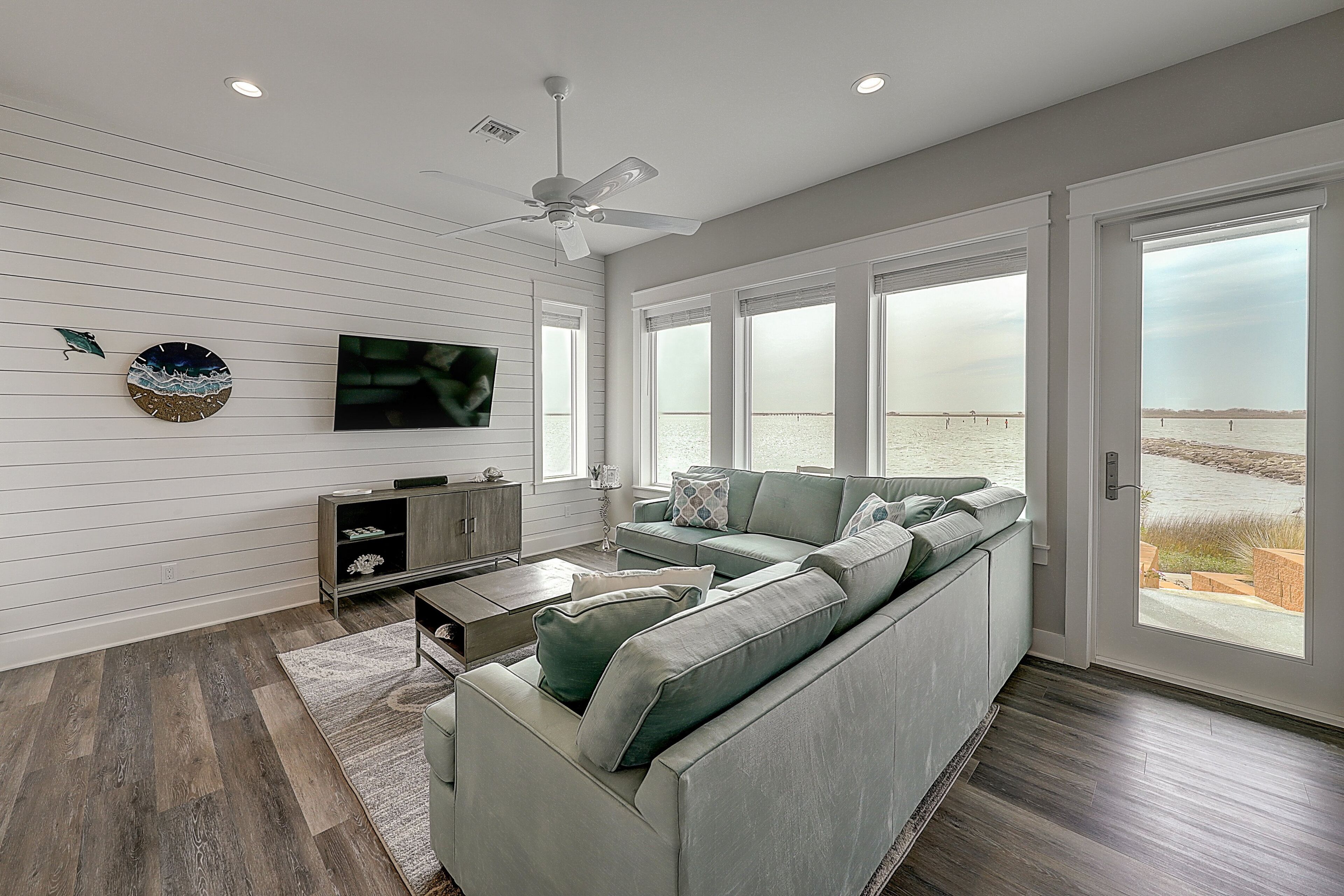 Waterfront haven with Bay views, patio, luxe suites, and shared dock and pool