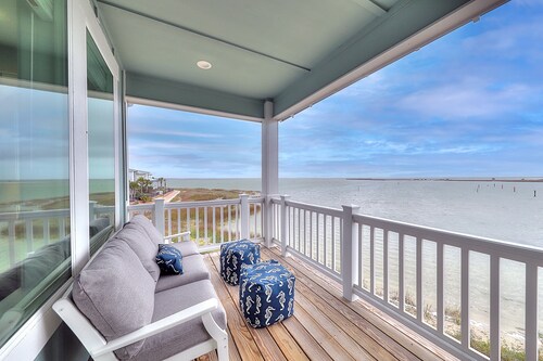 Waterfront haven with Bay views, patio, luxe suites, and shared dock and pool
