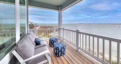 Waterfront haven with Bay views, patio, luxe suites, and shared dock and pool