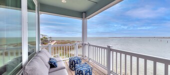 Waterfront haven with Bay views, patio, luxe suites, and shared dock and pool