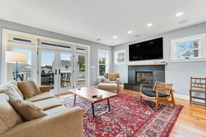 TV, fireplace - Canal-front getaway with private hot tub, large deck & firepit - dog-friendly (Ocean City)