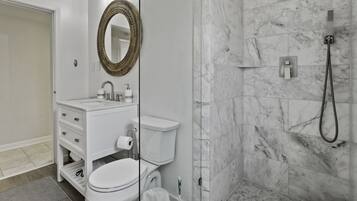 Shower, rainfall showerhead, hair dryer, towels