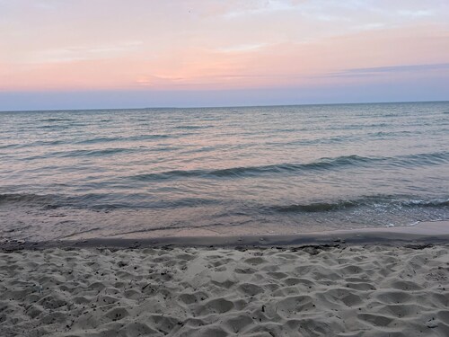 Lake Huron view just a minute walk to private sandy beach.